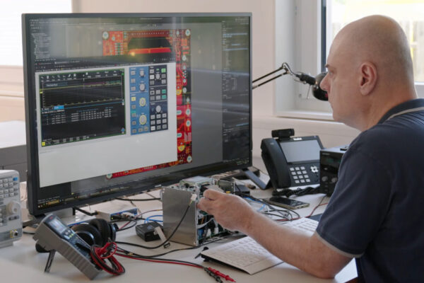 An engineer at TPS Elektronik GmbH is working on an electronic design.