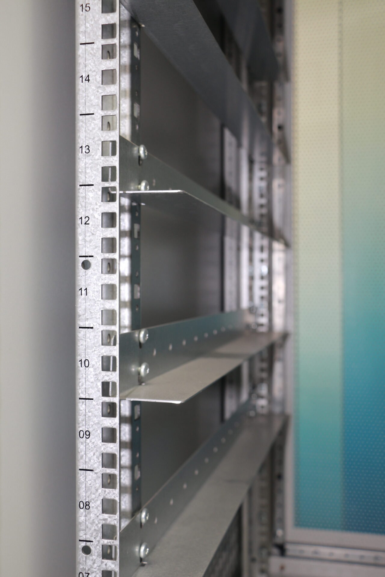 An extremely clear close-up shot with an industrial aesthetic. The center of the image shows a section inside the TPS server rack.