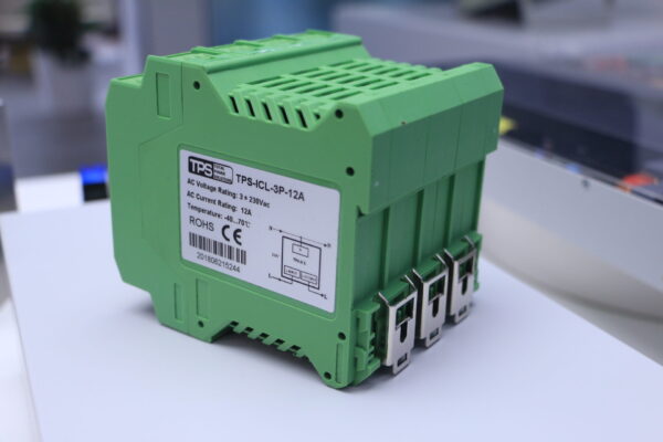 A close-up of certification markings on the surge current limiter housing, including compliance labels such as CE and RoHS.